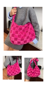 Macro view of large checkerboard plush tote bag with fuchsia faux fur texture details