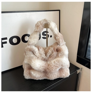 Detailed view showing the soft texture and fluffy faux fur material of the handbag