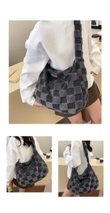 Detailed macro view of gray checkered plush tote bag with soft faux fur texture and wide strap