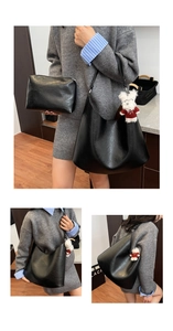 Detail of black pebbled leather hobo bag with matching small pouch and adjustable strap