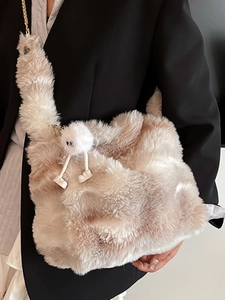Fashionable plush crossbody bag with cute doll pendant and gold chain strap for women