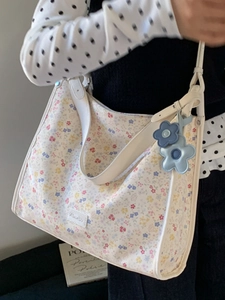 Floral print shoulder tote bag for women with decorative blue flower pendant accessory