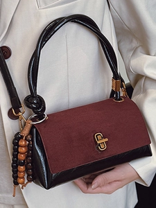 Retro burgundy suede and black leather handbag with gold clasp and wooden beads