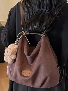 Vintage dark brown suede hobo bag with Banatu logo and cute plush bear charm