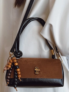 Retro contrast shoulder bag in brown suede and black leather with wooden bead charm