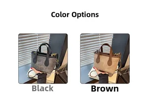 Detail view of the black and brown vintage bucket bags with gold hardware and straps