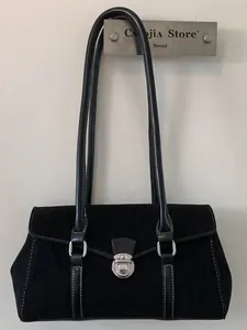 French vintage black suede shoulder bag with silver clasp lock in minimalist style
