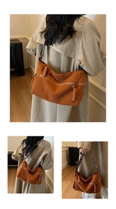 Detail of caramel corduroy shoulder bag with colorful woven strap and retro texture