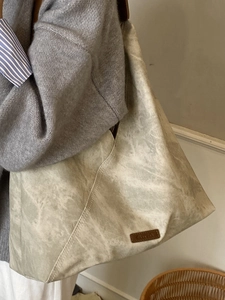 Large gray-green suede hobo tote bag for women featuring a vintage leather logo patch