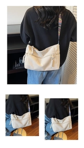 Detail of off-white corduroy crossbody bag with colorful ethnic patterned wide shoulder strap