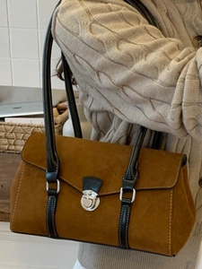 French vintage caramel suede baguette bag with black leather strap and silver clasp detail