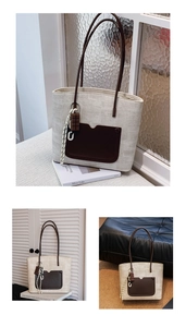 Detail view of woven tote bag with brown leather pocket and cute chocolate charm accessory