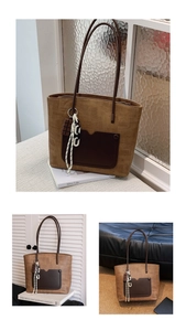 Close-up of caramel tote bag featuring textured leather, dark pocket and creative charms