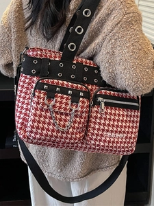 Fashionable red and white houndstooth tote bag with punk rivets and metal chain detail