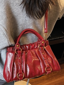 Vintage burgundy pleated baguette bag with glossy patent leather and gold ring hardware