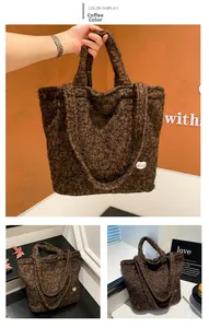 Detail view of coffee brown plush tote bag with lamb wool texture and heart patch