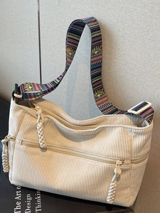 Off-white corduroy tote bag with bohemian printed strap and zippered front pocket