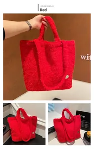 Detail view of a soft red faux fur tote bag featuring a heart metal ornament and dual handles