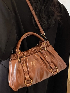 Retro pleated baguette bag in dark brown glossy PU leather with drawstring detail