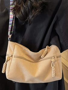 Minimalist beige corduroy tote bag with ethnic wide strap and dual front zipper pockets