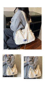 Detail of a beige canvas bag showing a purple logo patch and drawstring side pocket