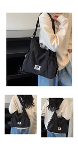 Detail view of black casual shoulder bag featuring side drawstring and white bear logo patch