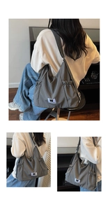 Detail of grey canvas backpack showing Phyron Bear label and adjustable drawstring pockets