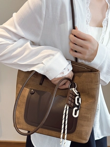 Vintage large brown straw tote bag with chocolate leather patch and stylish chain detail