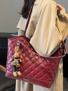 Chic quilted tote bag in deep red finish with a cute rabbit charm and large capacity