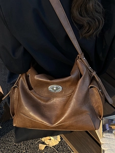 Vintage brown oil wax leather tote bag for women with silver oval metal lock and side pockets