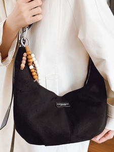 Black suede hobo bag with colorful wooden beads charm and minimalist shoulder strap