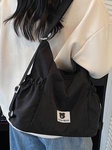 Minimalist large capacity black canvas tote bag with adjustable shoulder strap for women