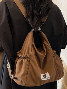 Brown large capacity canvas shoulder bag with MYRON BEAR logo and drawstring detail