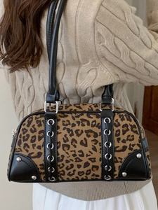 Vintage leopard print bowling bag with silver grommets and leather trim details