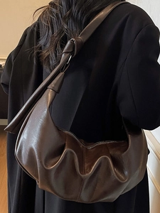 Large dark brown vintage leather slouchy shoulder bag with soft pleated design and knot strap