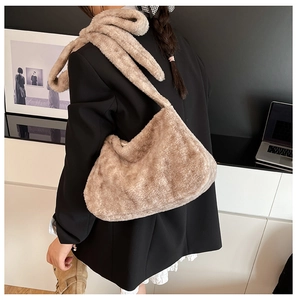 Detail of soft faux fur texture on a camel bucket bag for women autumn style