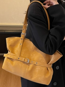 Large mustard yellow tote bag in soft synthetic leather with metallic buckle details