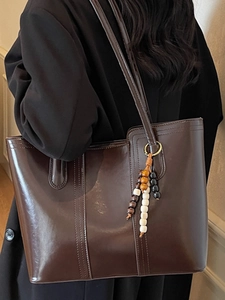 Minimalist large capacity dark coffee leather tote bag with stylish wooden bead tassel