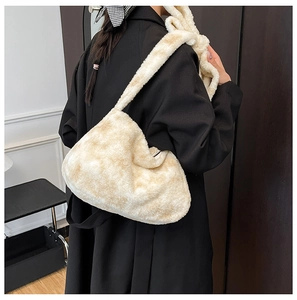 Beige faux fur plush hobo bag styled with a black wool coat for an elegant autumn look