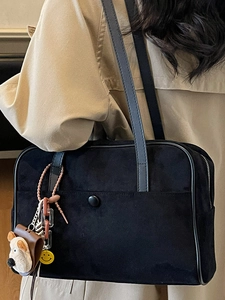 Retro black suede bowling bag for women featuring cute dog charms and shoulder strap style