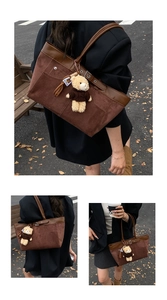 Detail view of brown faux suede tote bag with metal eyelets and a cute bear charm