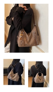 Detail of vintage brown tote bag with beaded tassel and versatile carrying straps