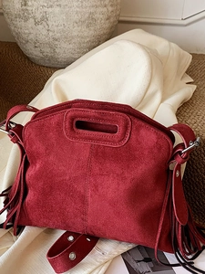 Retro burgundy suede shoulder bag with tassel fringe and adjustable silver hardware
