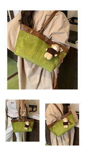 Detail of green tote bag featuring brown leather trim and a cute plush bear charm