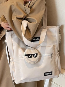 Grand sac cabas beige minimaliste avec bandoulière réglable pour les déplacements quotidiens