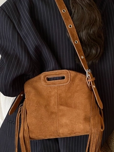 Chic brown suede crossbody bag with fringe details and retro style for women