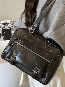 Retro black matte leather tote bag with functional pockets and adjustable strap
