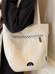 Sac fourre-tout minimaliste en toile crème avec broderie zigzag bleue et chien