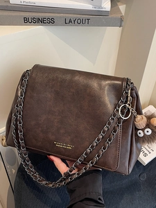 Large capacity brown vintage shoulder bag with chain strap and cute monster pendant