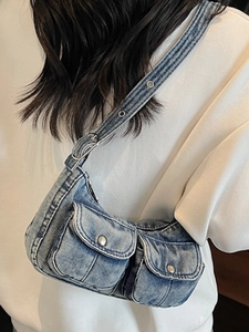 Retro washed denim shoulder bag with multi-pocket design and eyelet strap for women